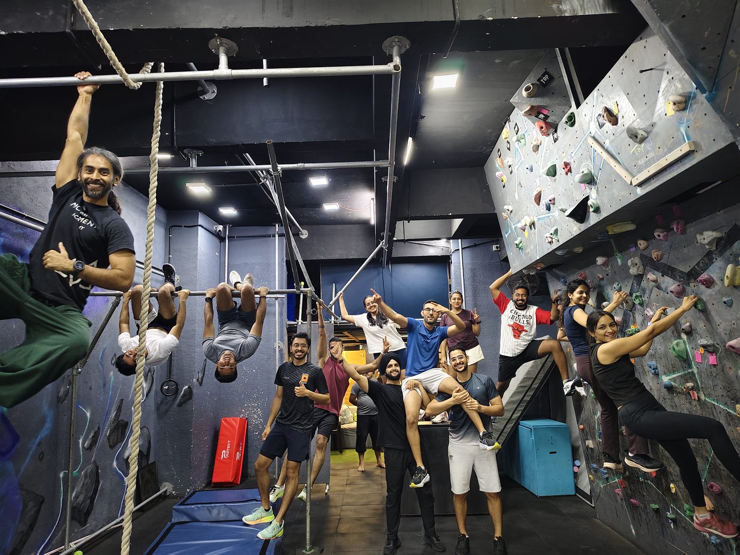 A team cheering a colleague through a climb